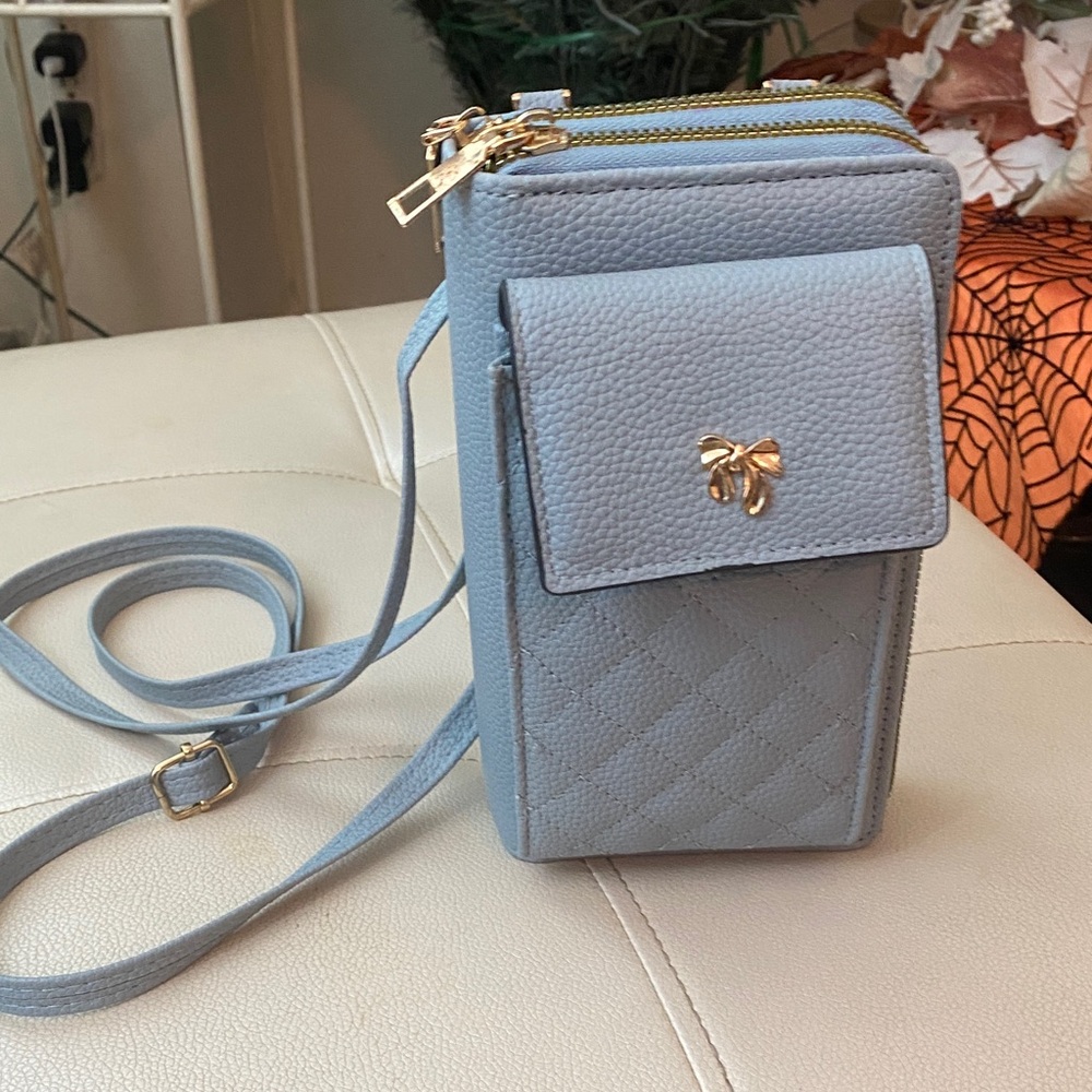 Elegant Blue Crossbody Bag with Gold Accents